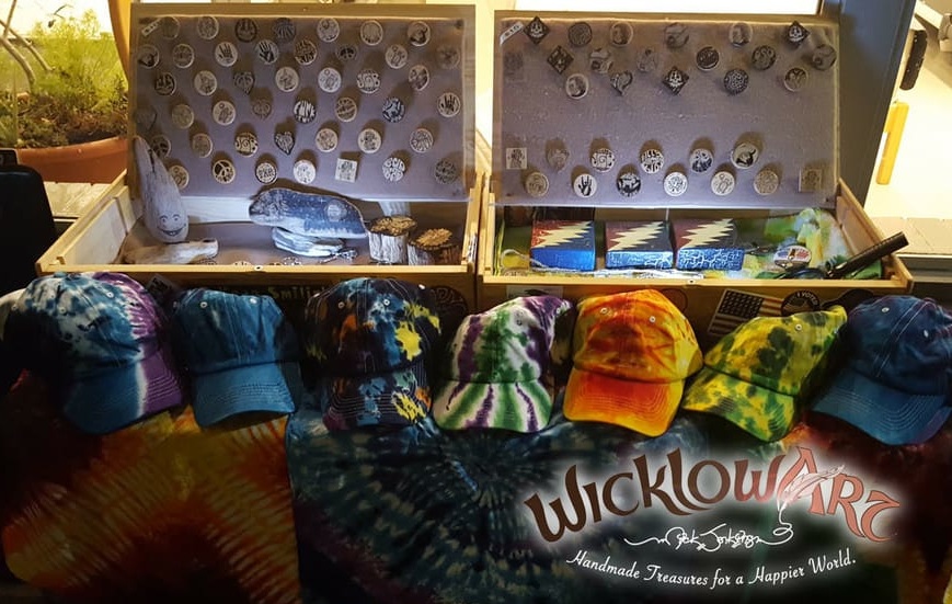 A display of WicklowArt pins, crafts and colorful hats